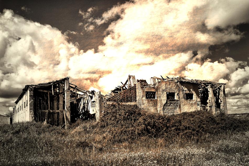 thick clouds over an old abandoned building