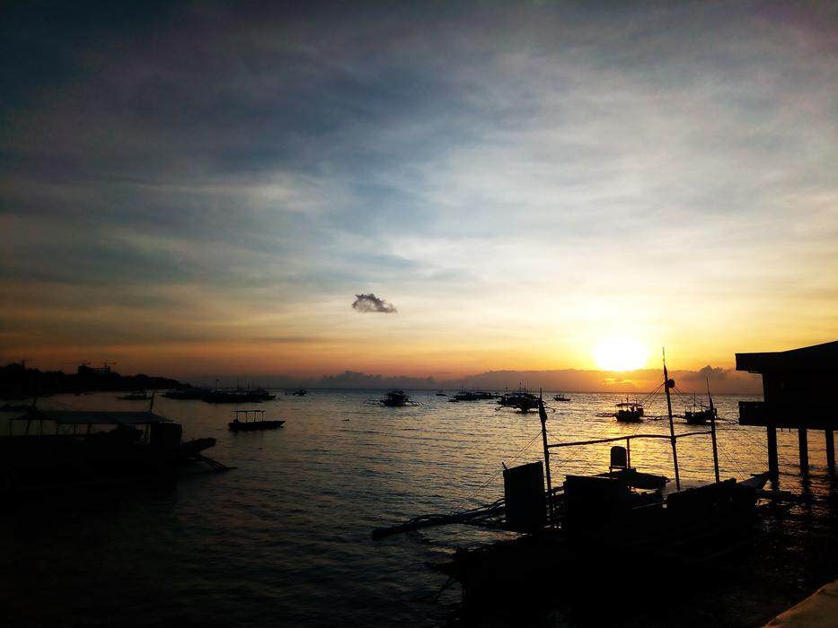 silhouette of a ship on a sunny background