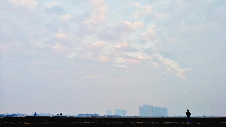 silhouettes of people city