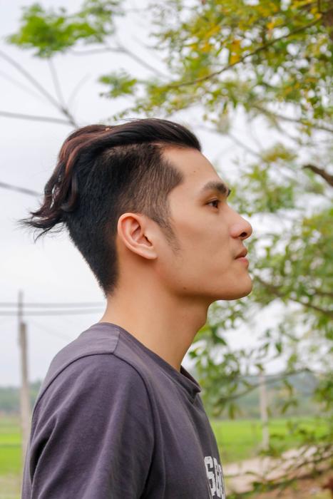 a man with a tail on his head