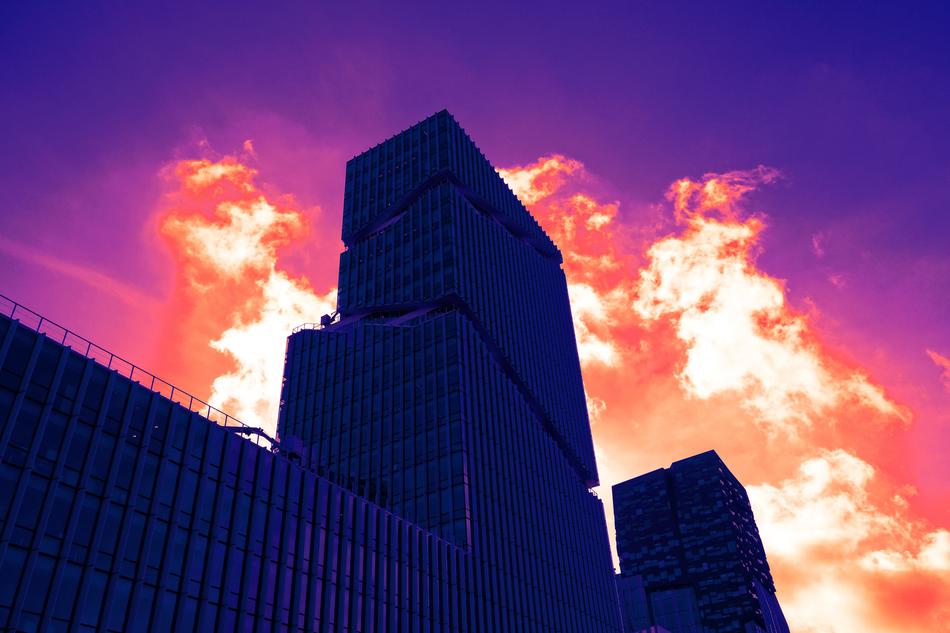 skyscraper against the background of a purple fiery sunset