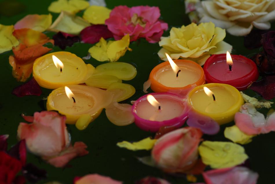 candles flowers petals lake