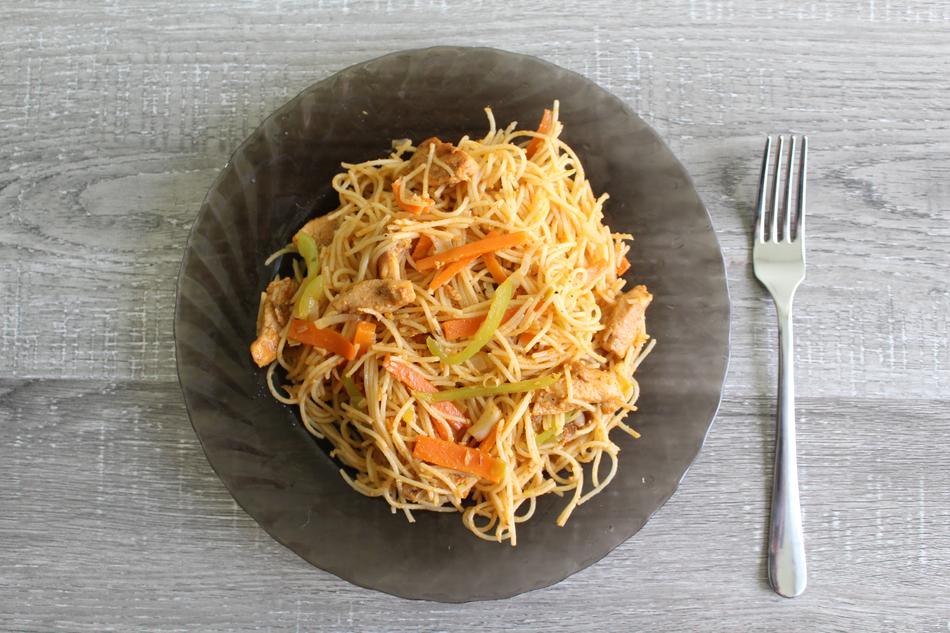 spaghetti with vegetables on a plate