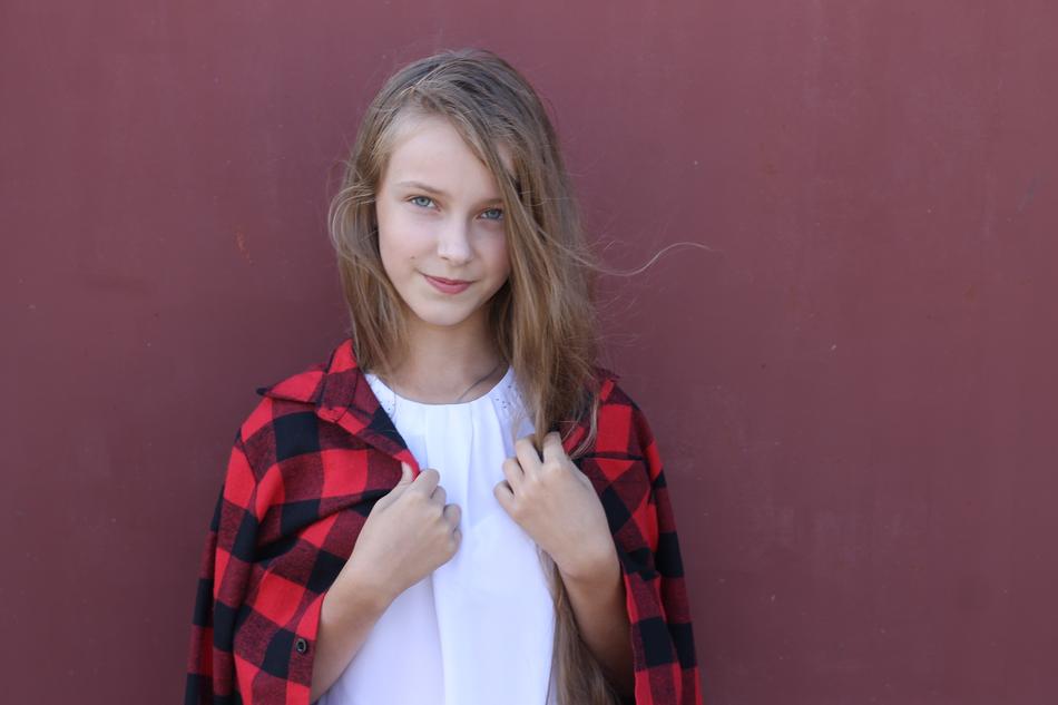 Girl by the Garage wall