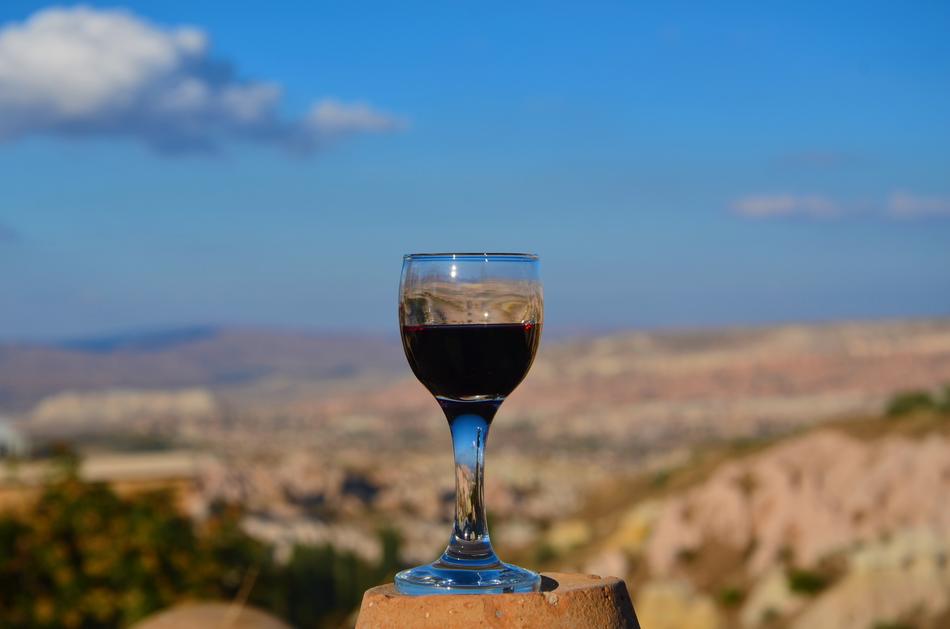 a glass of wine overlooking the plains