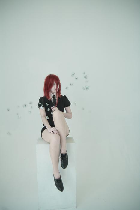 Girl with red hair, making cosplay from Land of the Lustrous