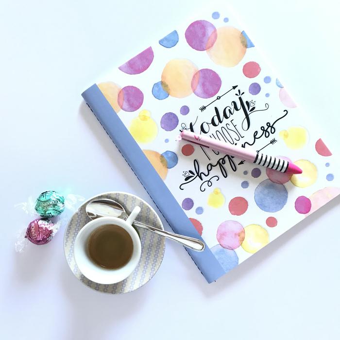 colorful notebook with a coffee mug