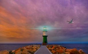 Lighthouse On Ocean rocky shore
