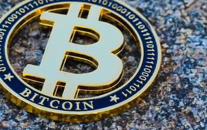 bitcoin on granite stone, close-up