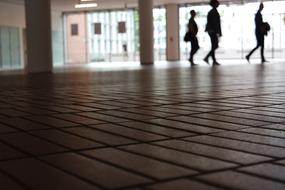 people walk on the tiled floor