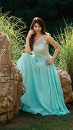 a girl sitting in a long skirt