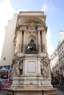 statue on a fountain in paris