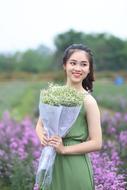 Portrait of Girl with flowers field