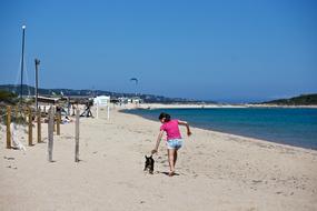 Girl and Dog at Beach