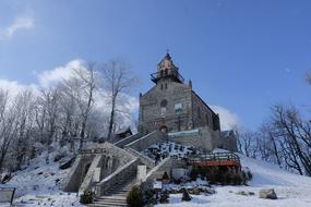 stone building with white snow