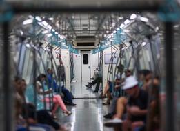 People in the train in the subway with lights