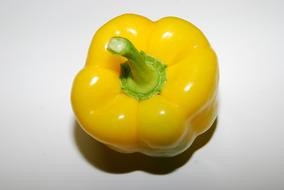 yellow healthy peppers on a white plate