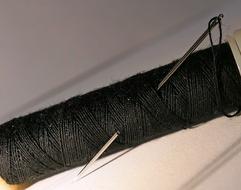 green thread and needle kind of thing.