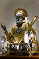 golden sculpture of a saint