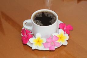hot coffee mug decorated with flowers
