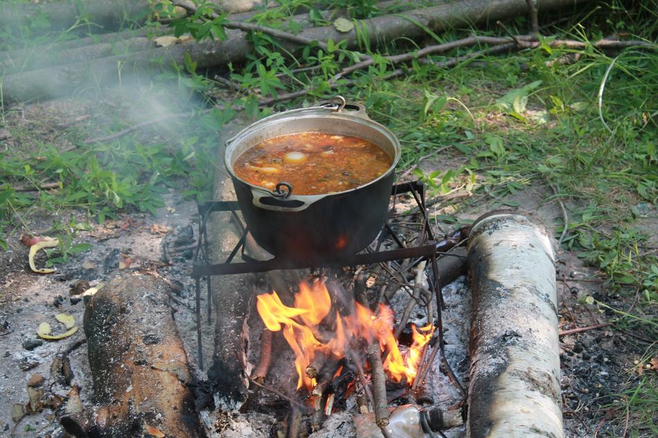 hot soup over a campfire