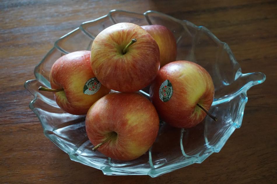 juicy colored apples in a plate