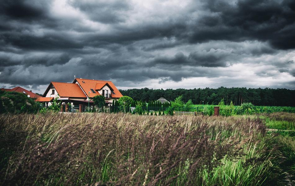 House Cottage and dark Clouds