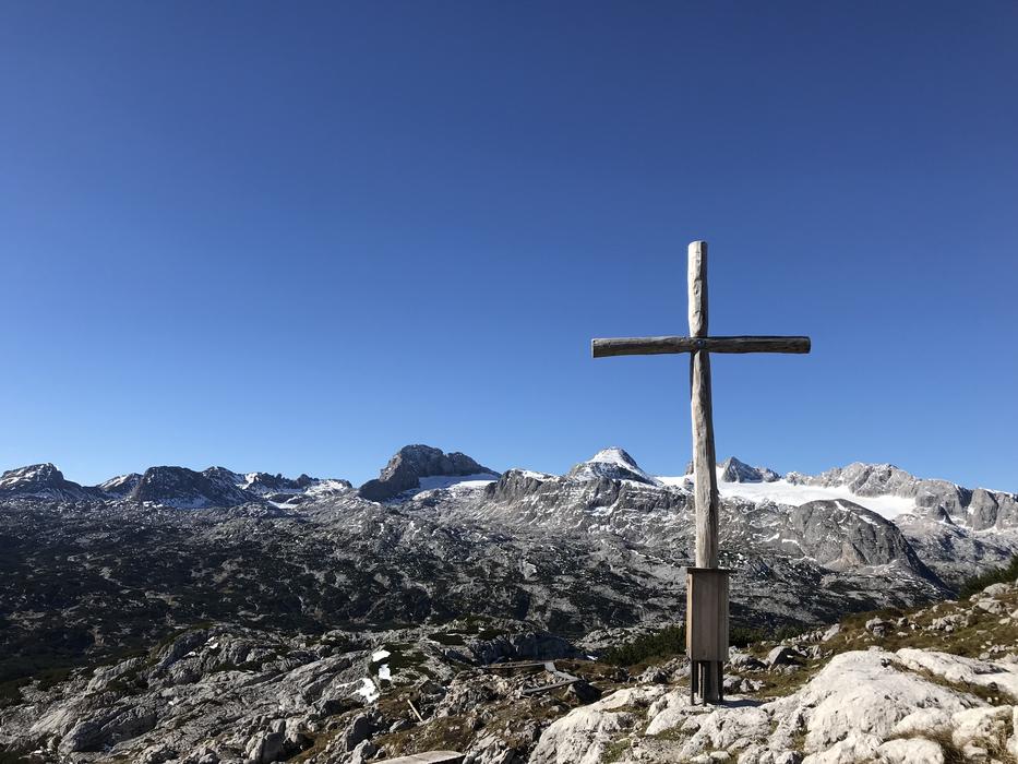 the cross is white on a blue sky background