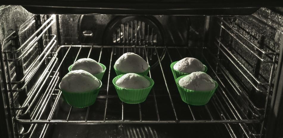 white cupcakes in green paper