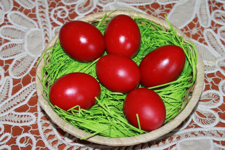 red beautiful eggs on the grass