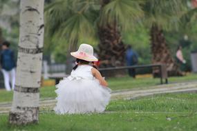 girl in a white dress under the palm trees