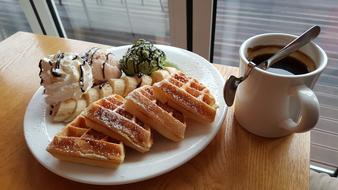 Fresh sweet waffles with coffee