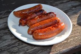 Juicy sausages in a plate