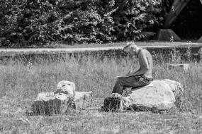 Black And White photo of Male on The Stones