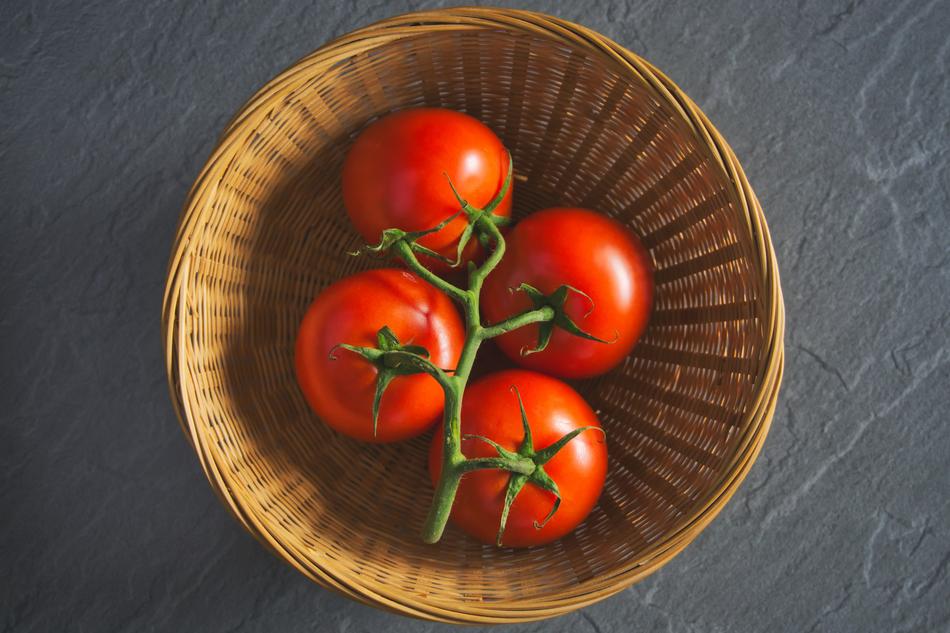tasty tomatoes in a basket