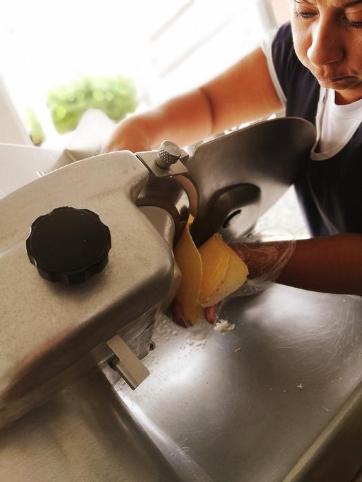 chef slices cheese