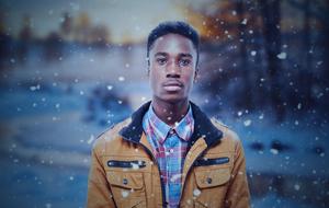 student in yellow jacket in winter