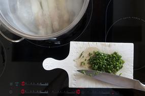 chopped greens on a board