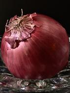pink unpeeled onions