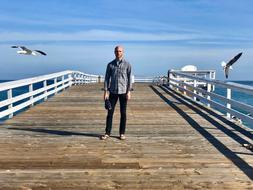 Portrait of Man on bridge by the Ocean