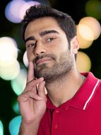 a man with a beard in a red t-shirt