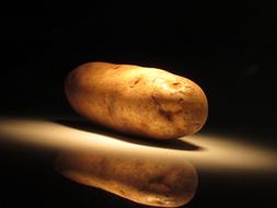 Unpeeled potatoes on a plate