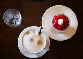 foamy coffee with strawberry dessert