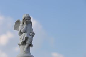 stone angel in the blue sky