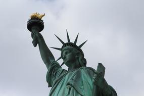 sculpture of freedom clouds view