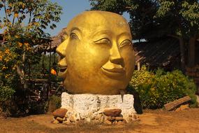 golden mask on a stone