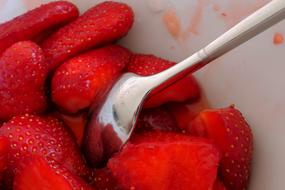 spoon in a strawberry