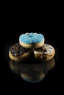 sugar donuts on a black background