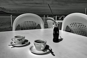 mugs with hot coffee on the table