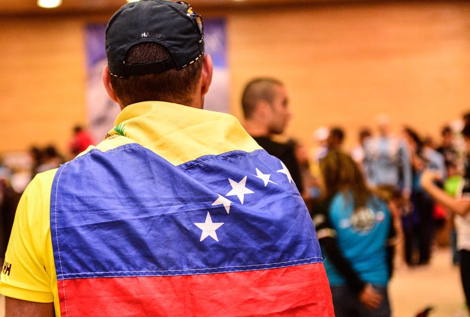 a man with a flag on his shoulders
